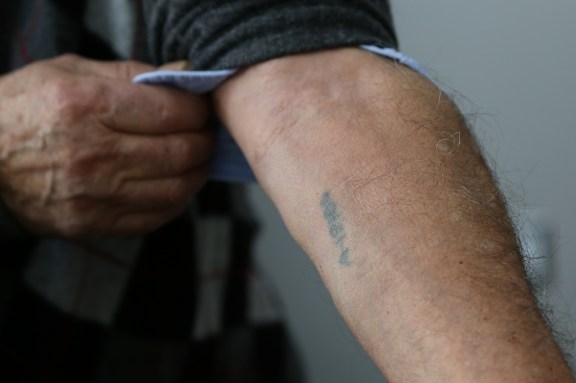 Howard Kleinberg. Auschwitz tattoo A-19186. (Michel Botman Photography, Toronto, February 2013)