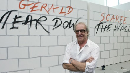 Gerald Scarfe before a representation of the Israeli Security Wall (Google Images)